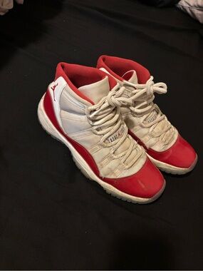 Jordan Cherry 11’s Red and White High-Top Sneakers